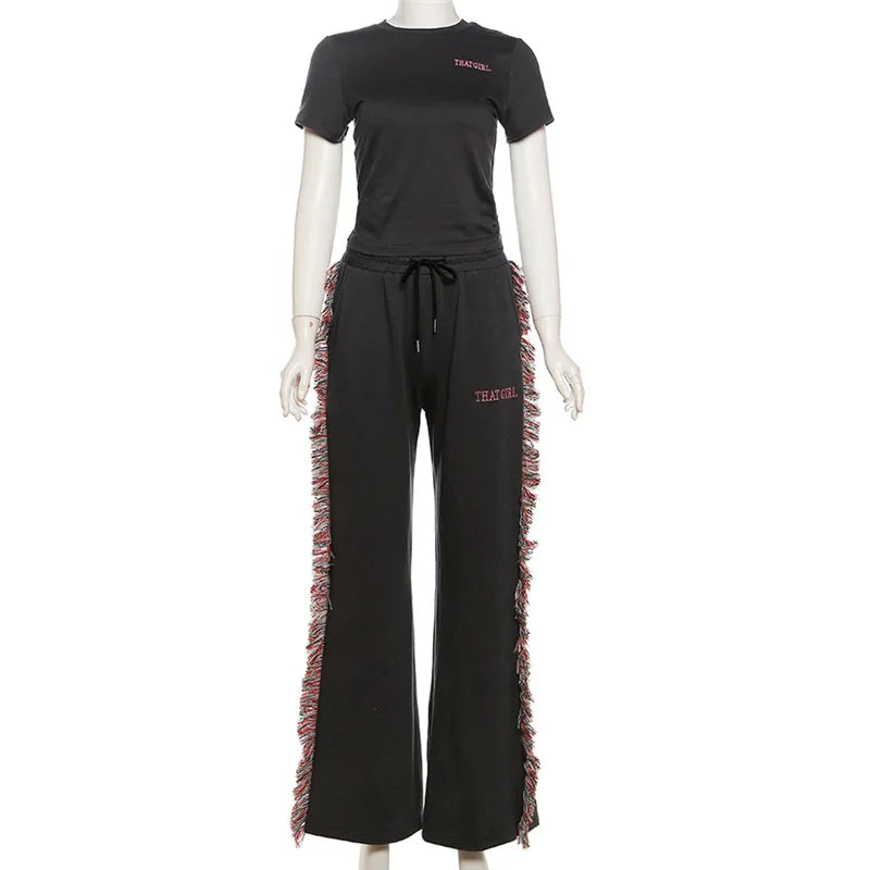 Elegant two-piece outfit featuring fringe detailing, perfect for stylish and sophisticated fashion statements.