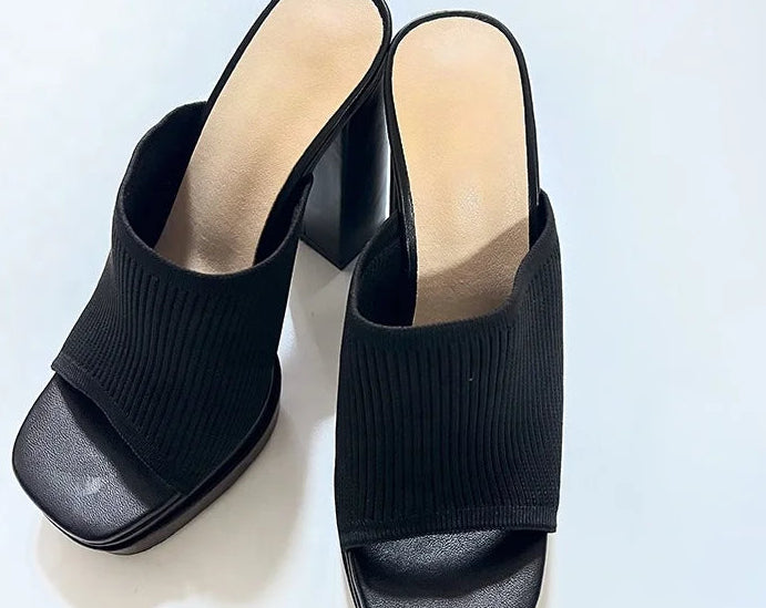 Black platform sandals on a white background with 'Jessica' branding.