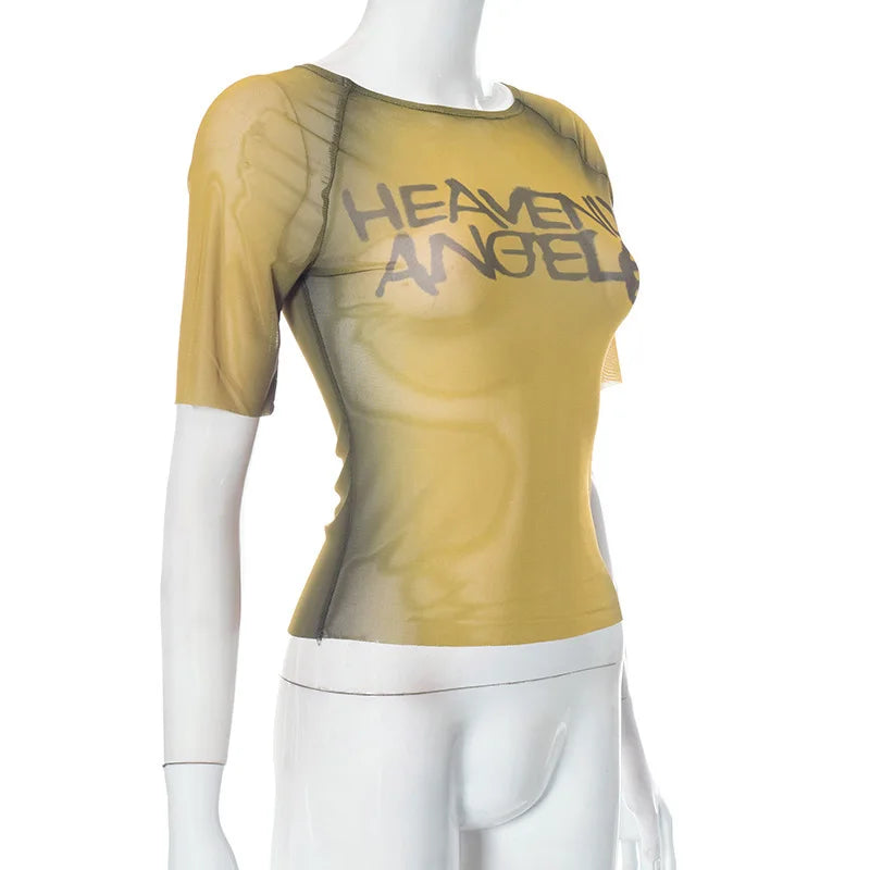 Mannequin wearing a mustard yellow 'HEAVENLY ANGEL' top on a white background
