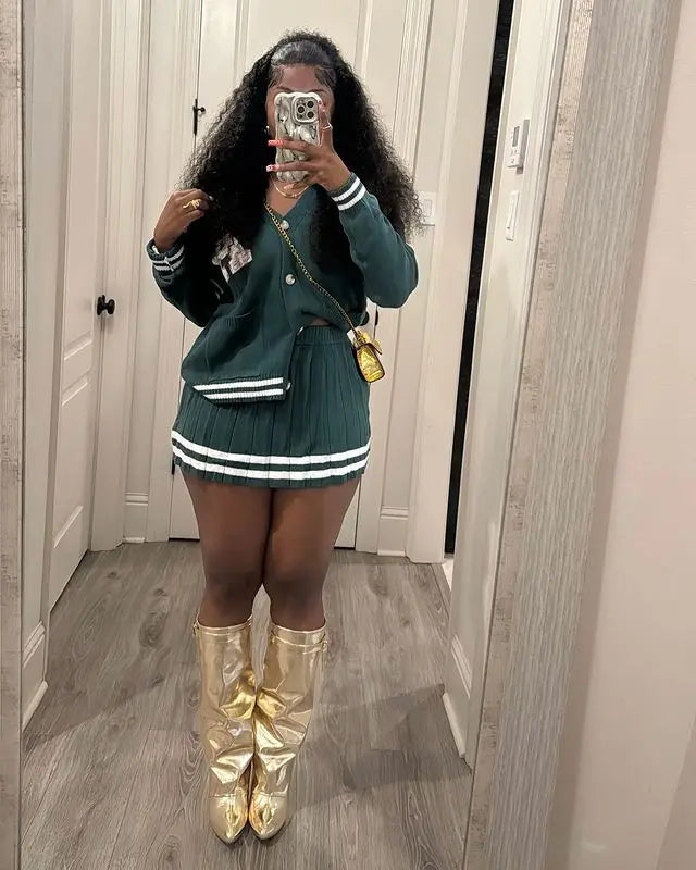 Knit Stripe Two-Piece Cardigan Top and Pleated Skirt Set.