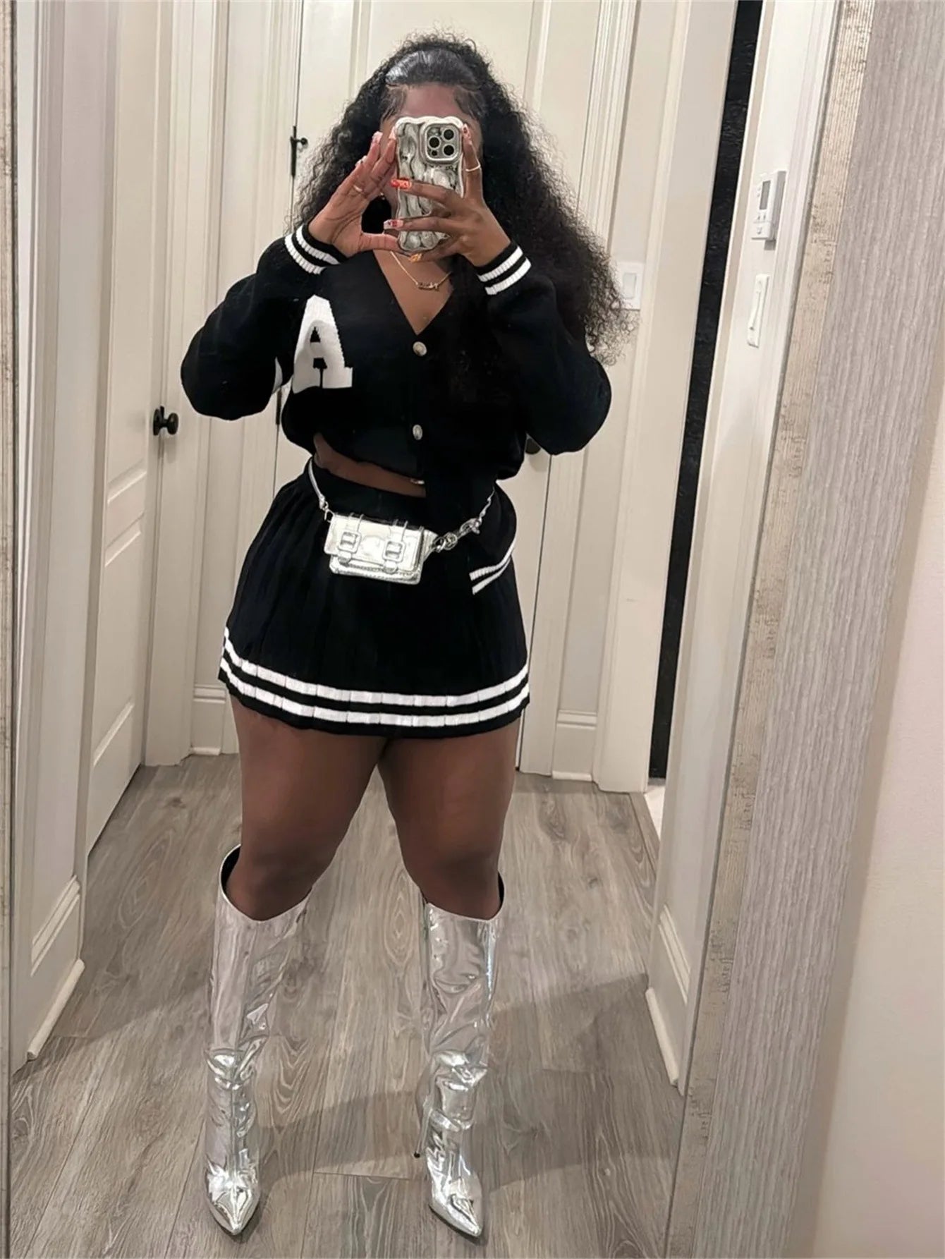 Knit Stripe Two-Piece Cardigan Top and Pleated Skirt Set.